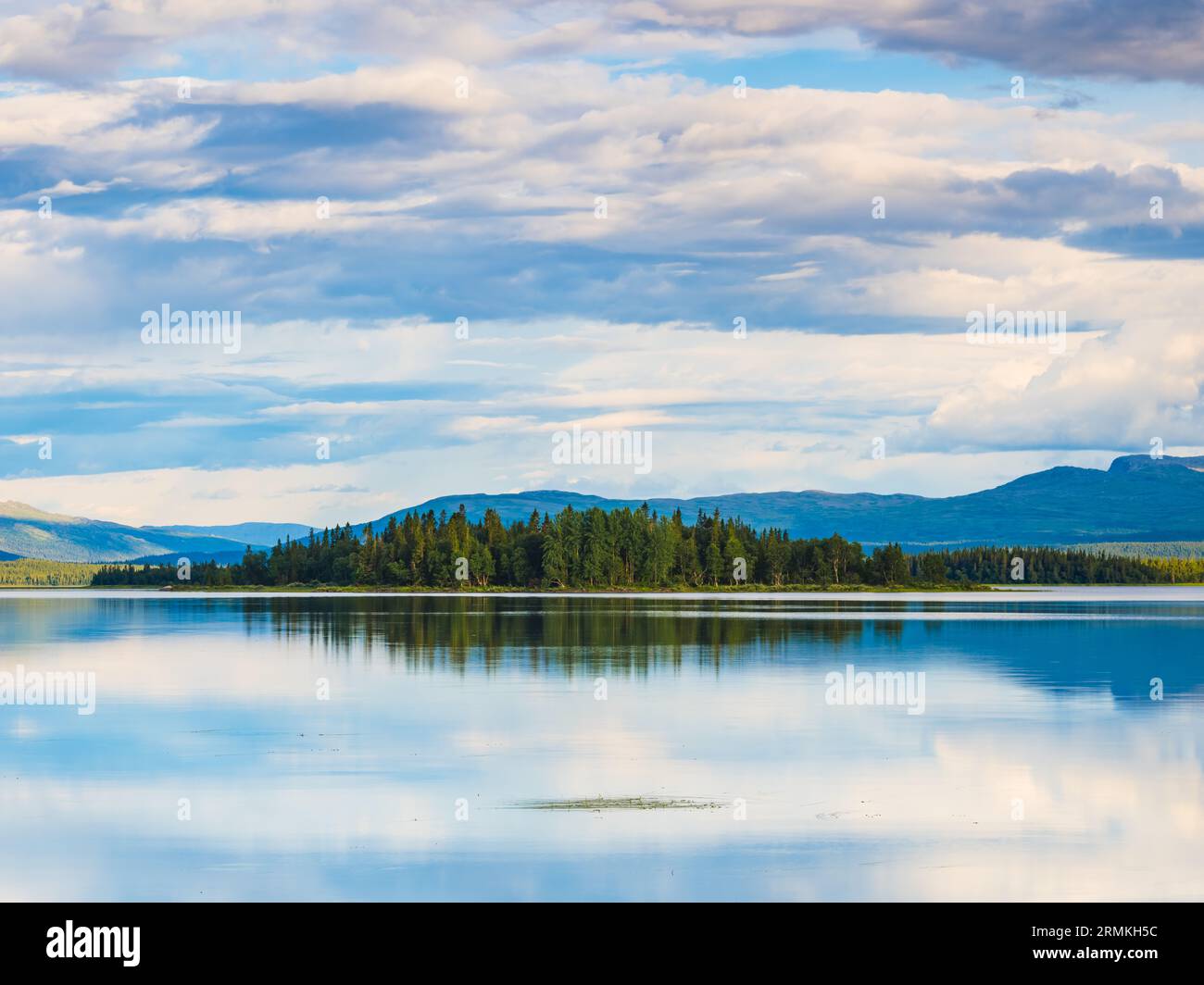 Tranquil nature scene: lake, trees, reflection, Sweden. Stock Photo