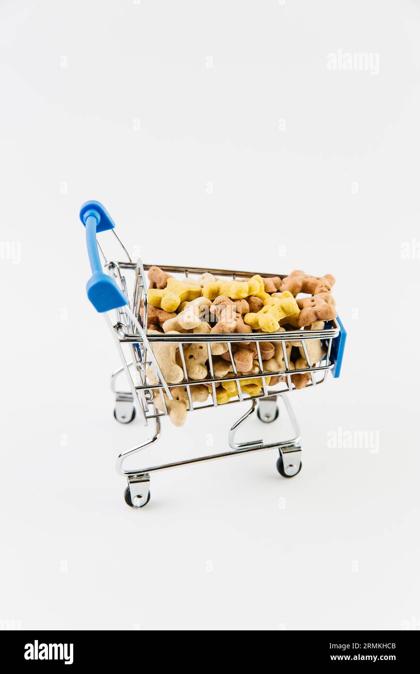Decorative cart with dry pet food Stock Photo