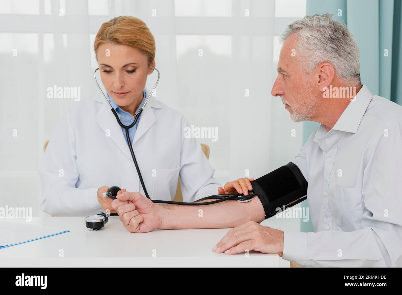 Doctor examining blood pressure old hi-res stock photography and images ...