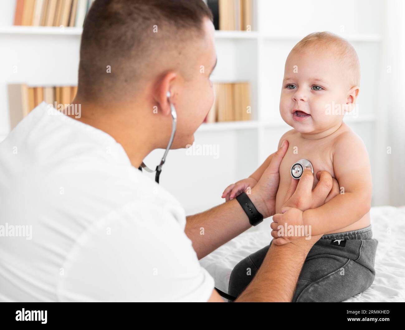 Doctor listening little baby with stethoscope Stock Photo