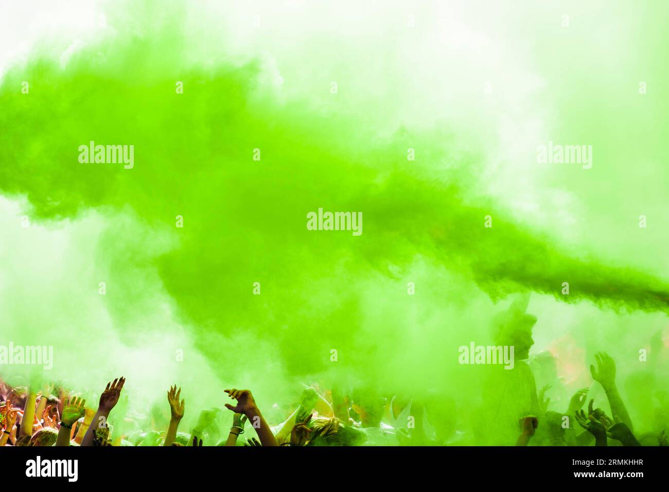 Explosion green holi color crowd Stock Photo