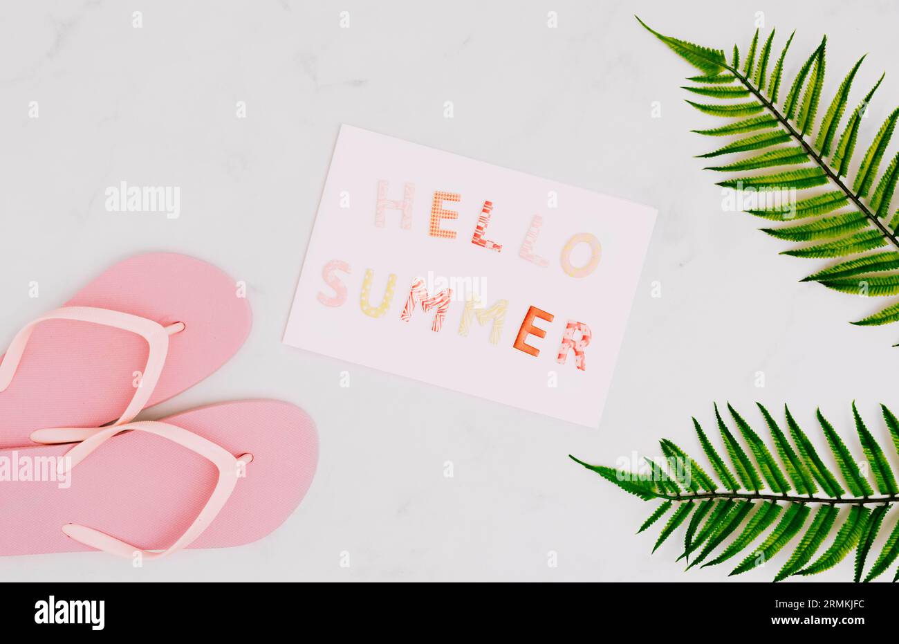 Paper with message hello summer flip flops Stock Photo