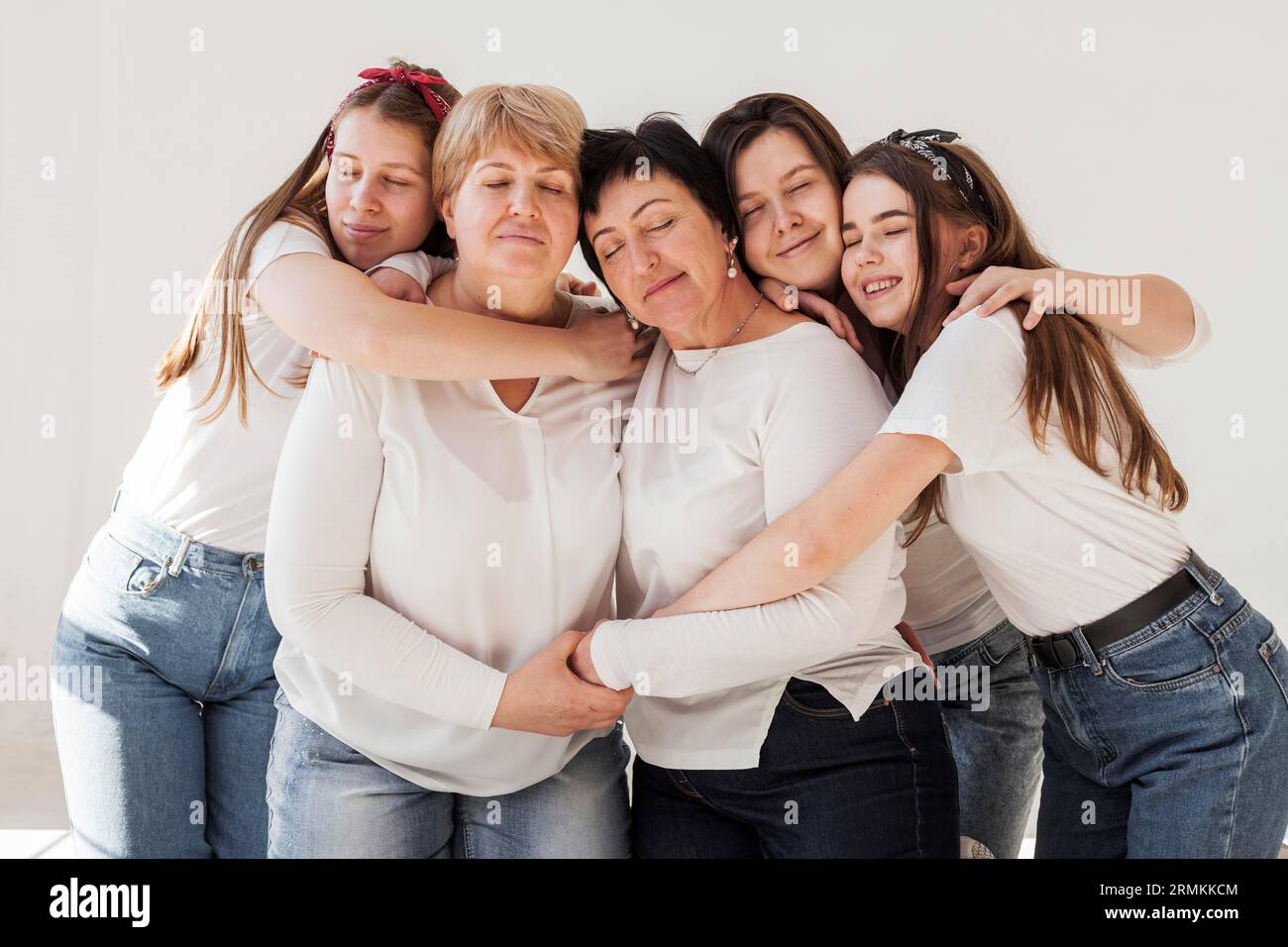 Togetherness group women hugging Stock Photo