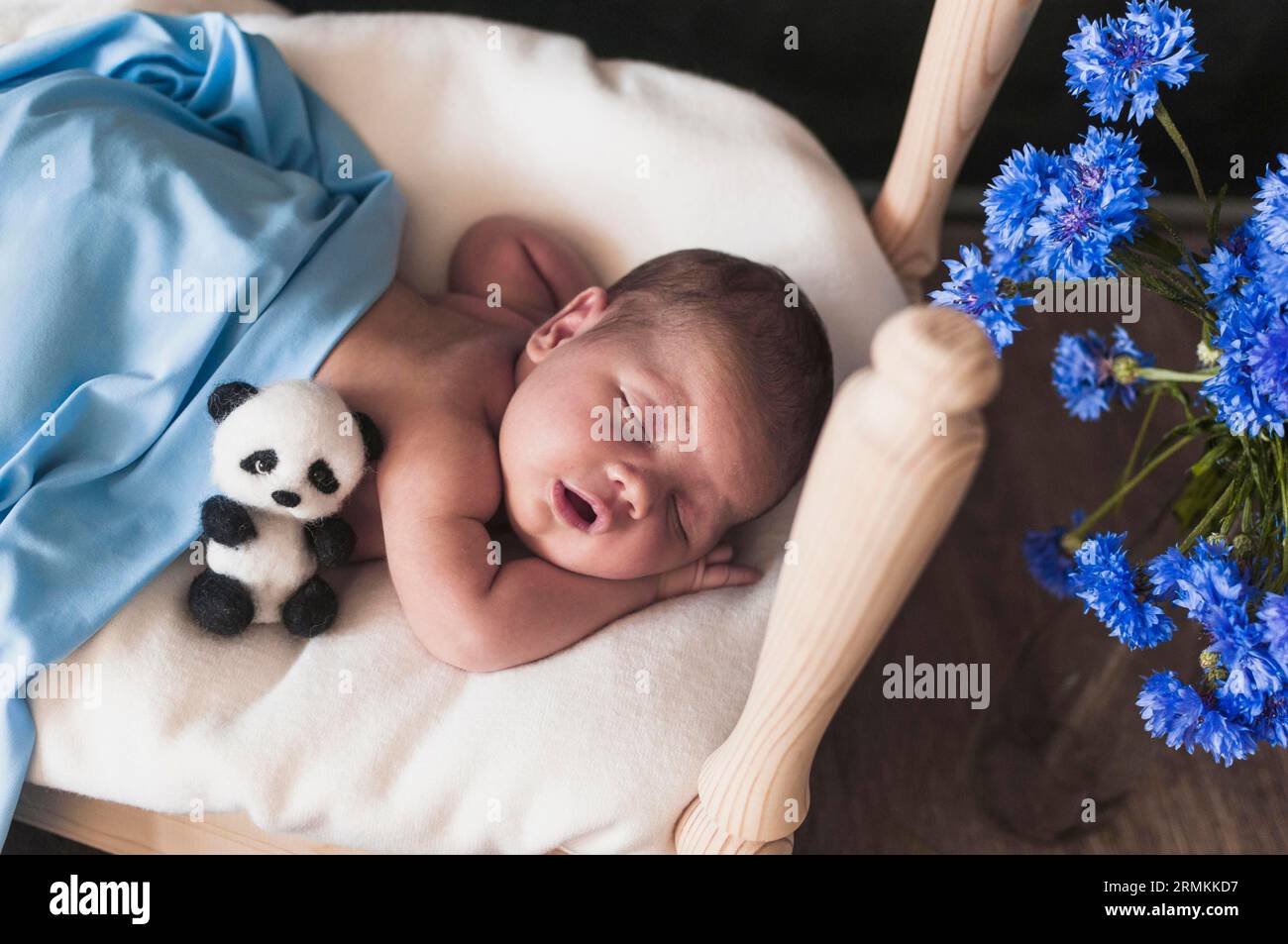 Tiny child blue blanket Stock Photo