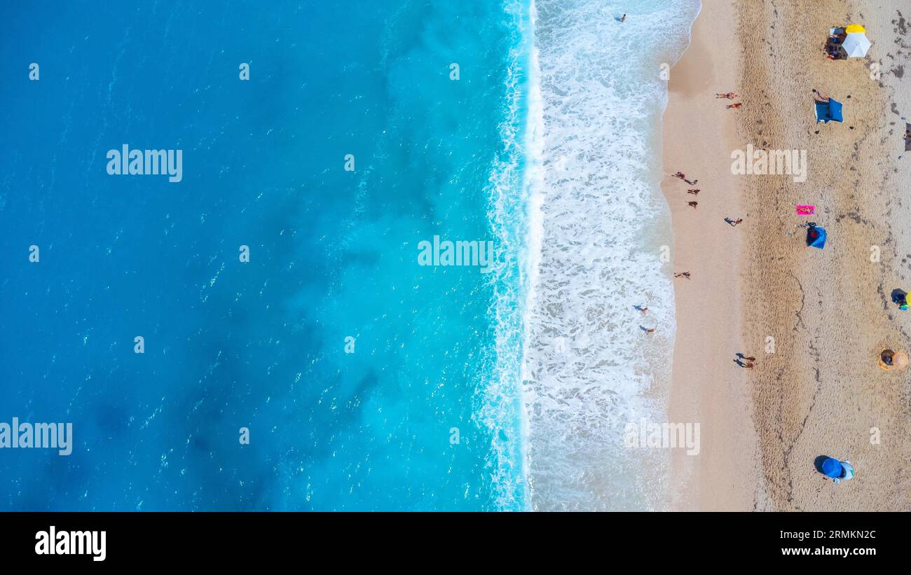 Aerial drone aerial shot in summer on paradise sandy beach Megali Petra in Lefkada. Beautiful crystal clear turquoise and blue waters. Greece Stock Photo