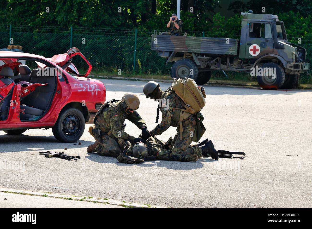 Bundeswehr soldiers attend to an injured soldier during a demonstration, Bundeswehr Day, Munich, Bavaria, Germany Stock Photo