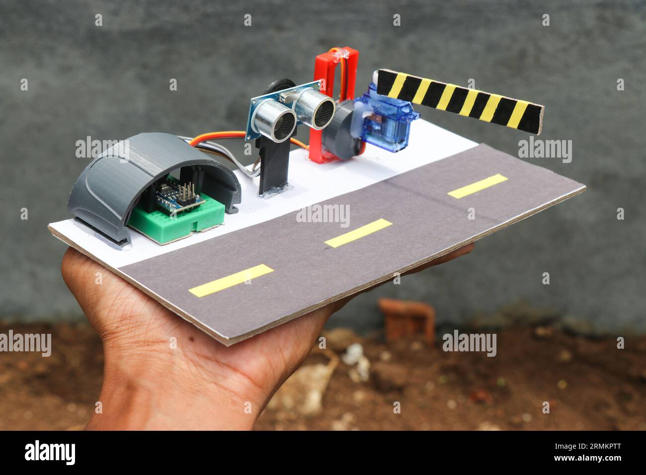 Prototype of automatic toll gate system using ultrasonic sensor sensor and servo with programmable microcontroller Stock Photo