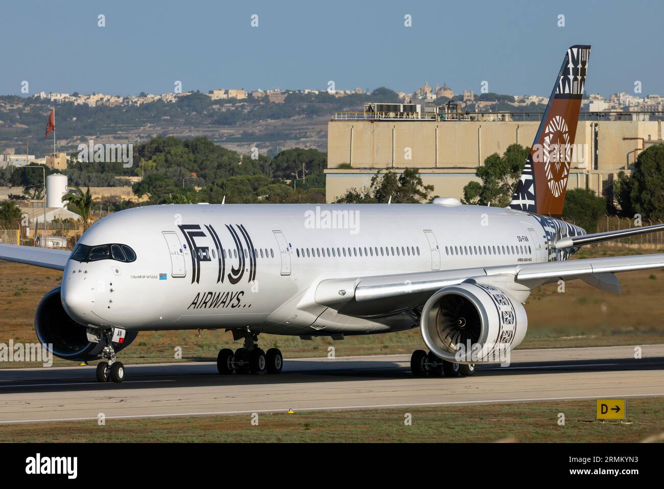Fiji Airways Airbus A350-941 (REG: DQ-FAN) departing to enter service after being serviced at LTM. Stock Photo