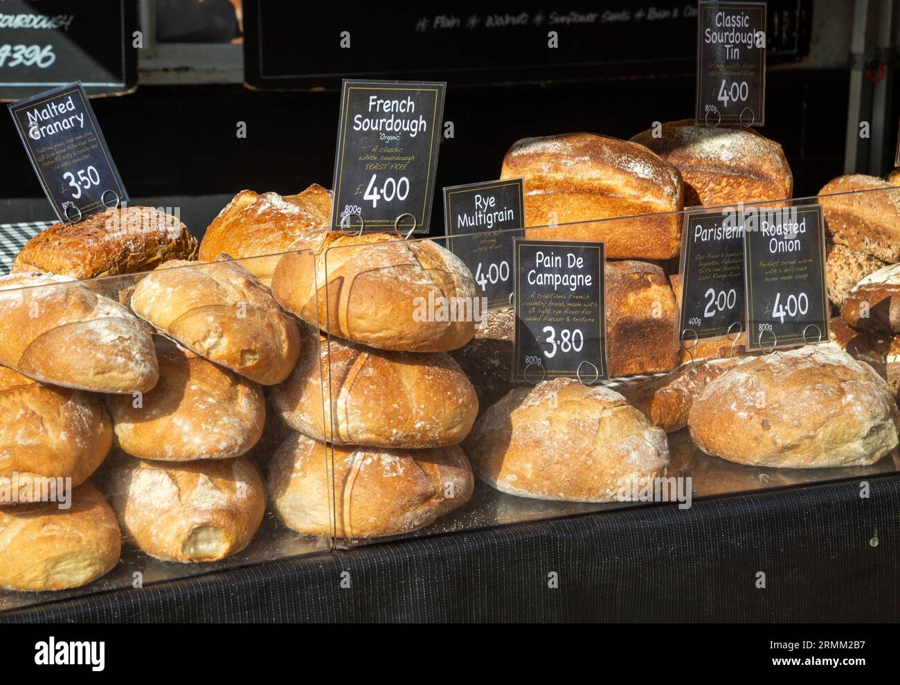 Fresh loaves of artisan bread on sale at street market stall