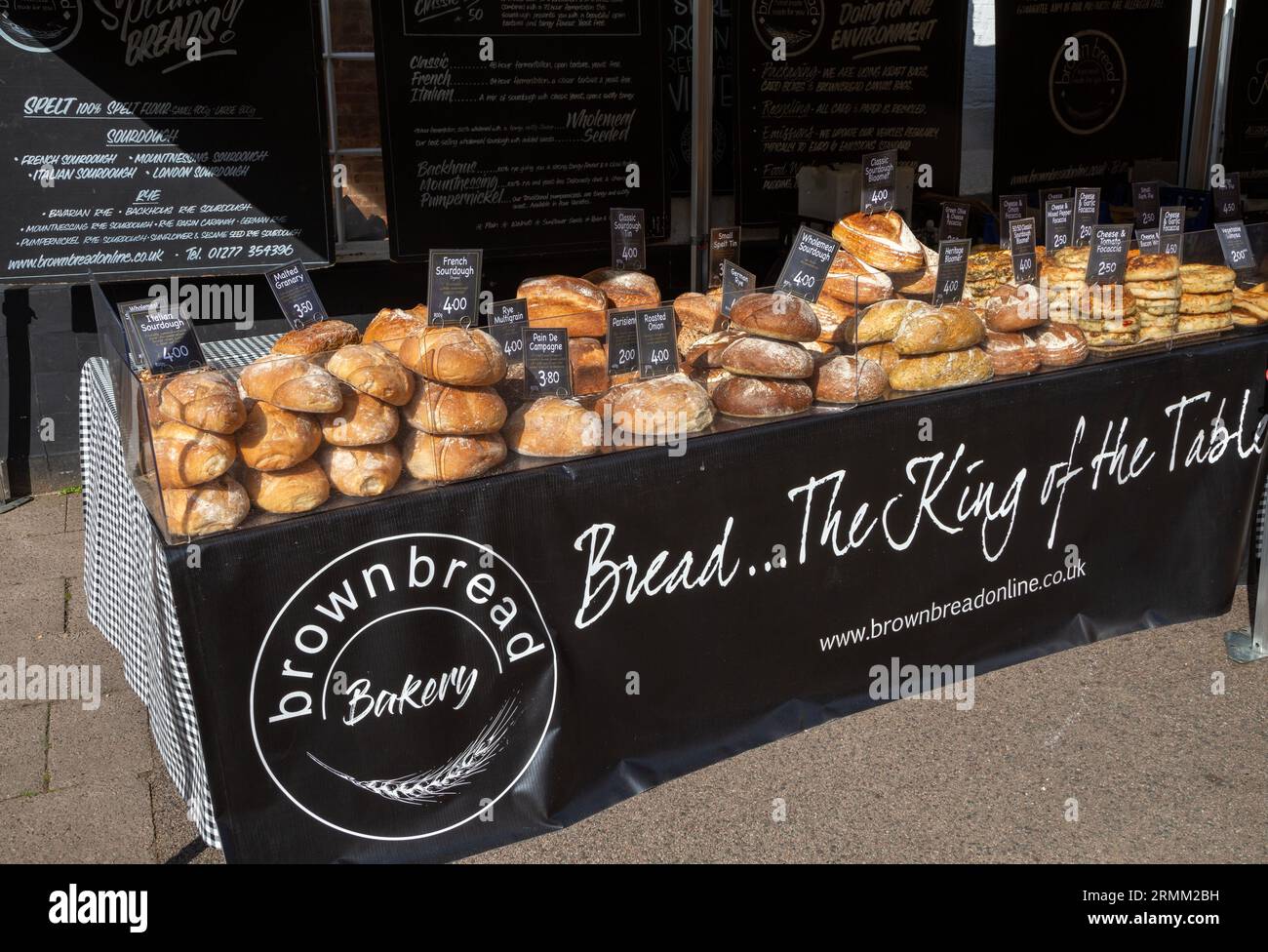 Fresh loaves of artisan bread on sale at street market stall