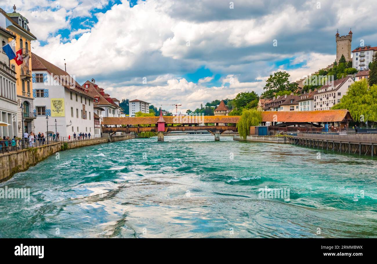 Great panoramic view of the whole Spreuer Bridge in Lucerne, Switzerland. The southern half is perpendicular to the River Reuss, while the northern... Stock Photo