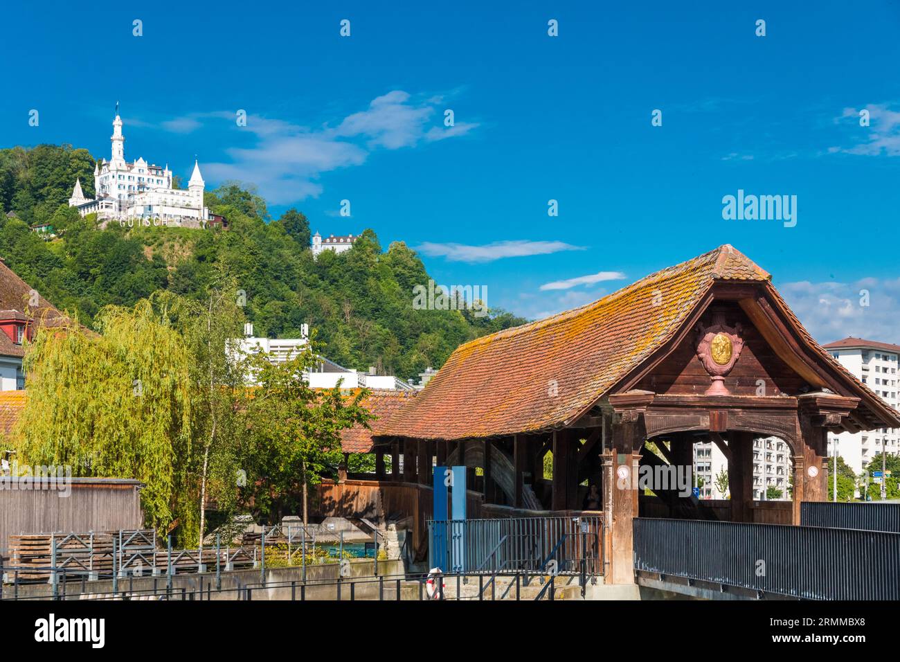 Picturesque view of the entrance at the north wing of Lucerne's famous Spreuer Bridge on the Mühlenplatz side. In the background on the Gütsch hill... Stock Photo