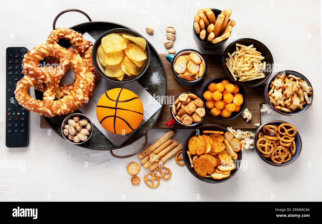 Set of various basketball fans and stadium snacks, chips, sauces on a ...