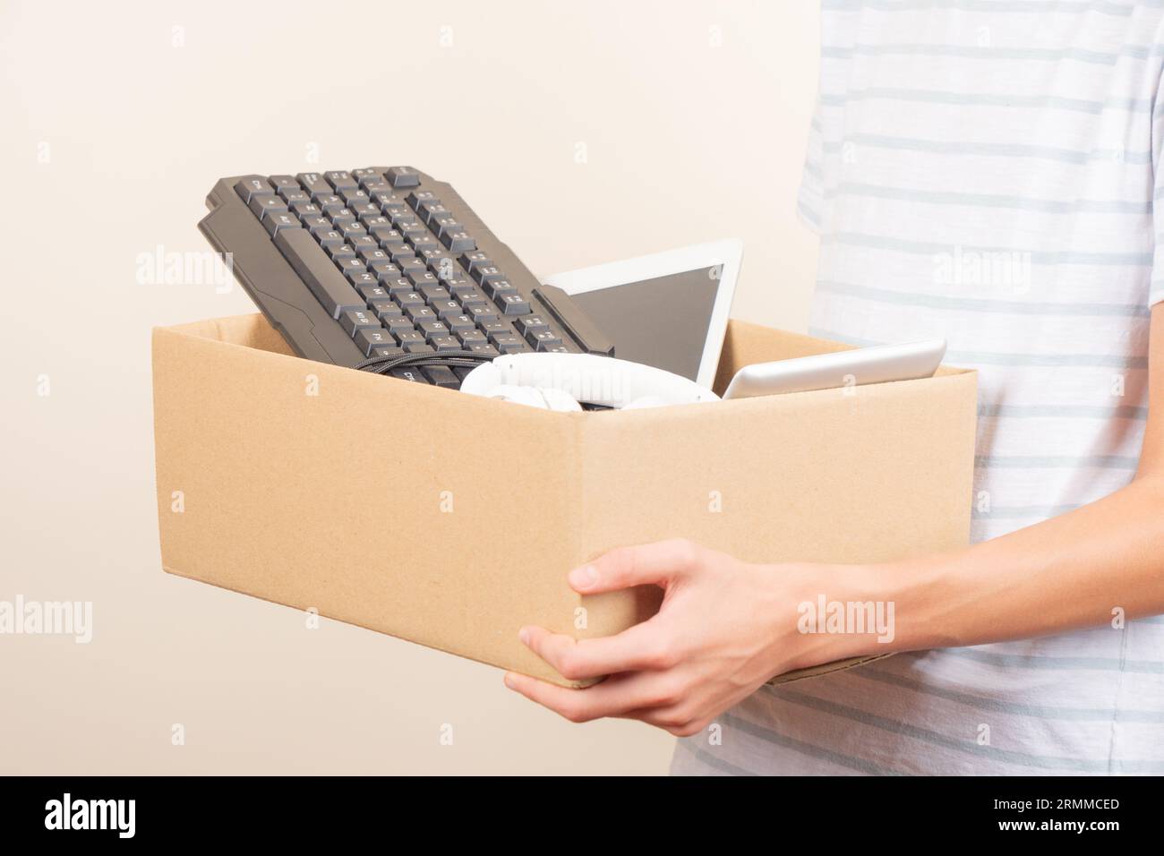 Donate technology to charity. Volunteer hands holding cardboard box ...