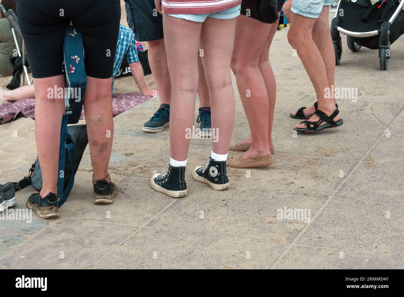 Group stand at the beach Stock Photo - Alamy