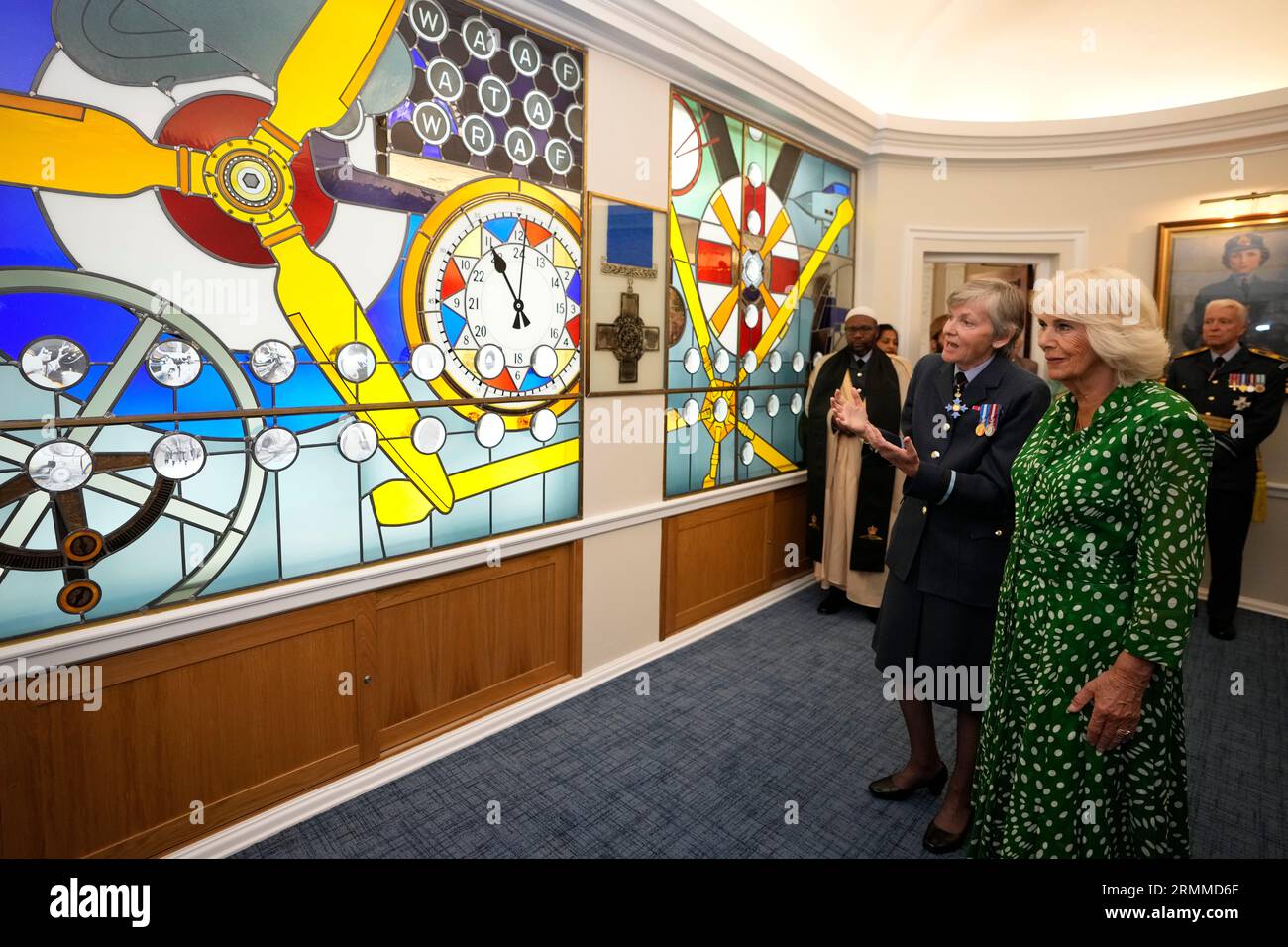 Queen Camilla is shown stained glass windows that celebrate 100 years of women in support of and service in the RAF at the Royal Air Force Club in Piccadilly, central London, where she unveiled a portrait of Special Operations Executive (SOE) Operative, Noor-un-Nisa Inayat Khan GC, and formally announced the naming of a room in her honour. Picture date: Tuesday August 29, 2023. Stock Photo