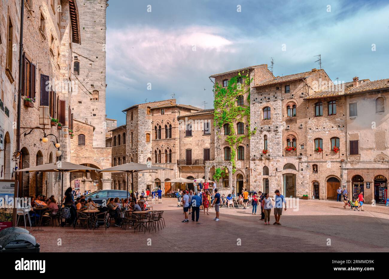 Piazza della Cisterna in San Gimignano, Italy. Built in 1287, it is  surrounded by houses and towers. Stock Photo