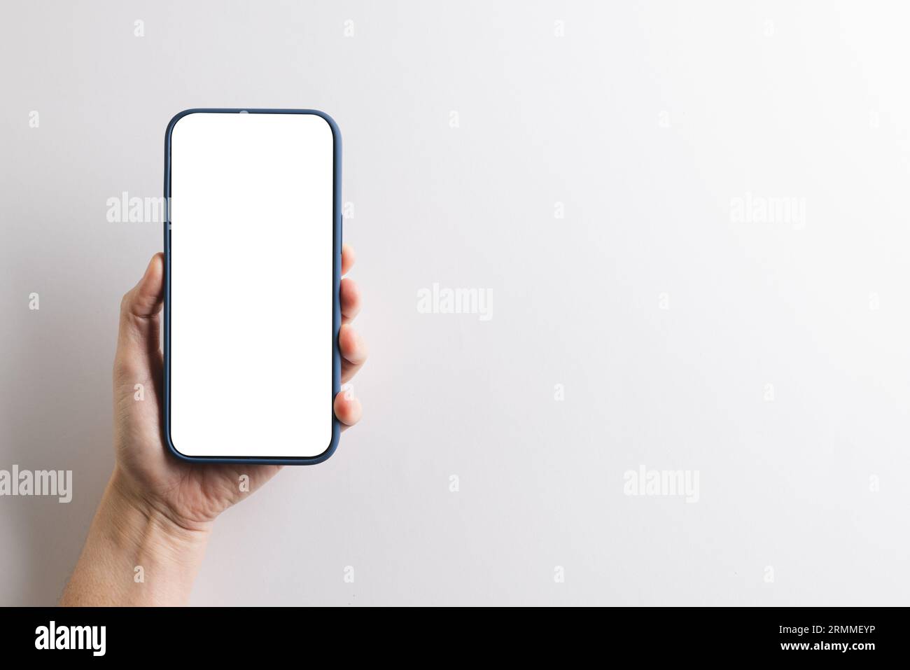 Hand of caucasian woman holding smartphone with blank screen and copy ...