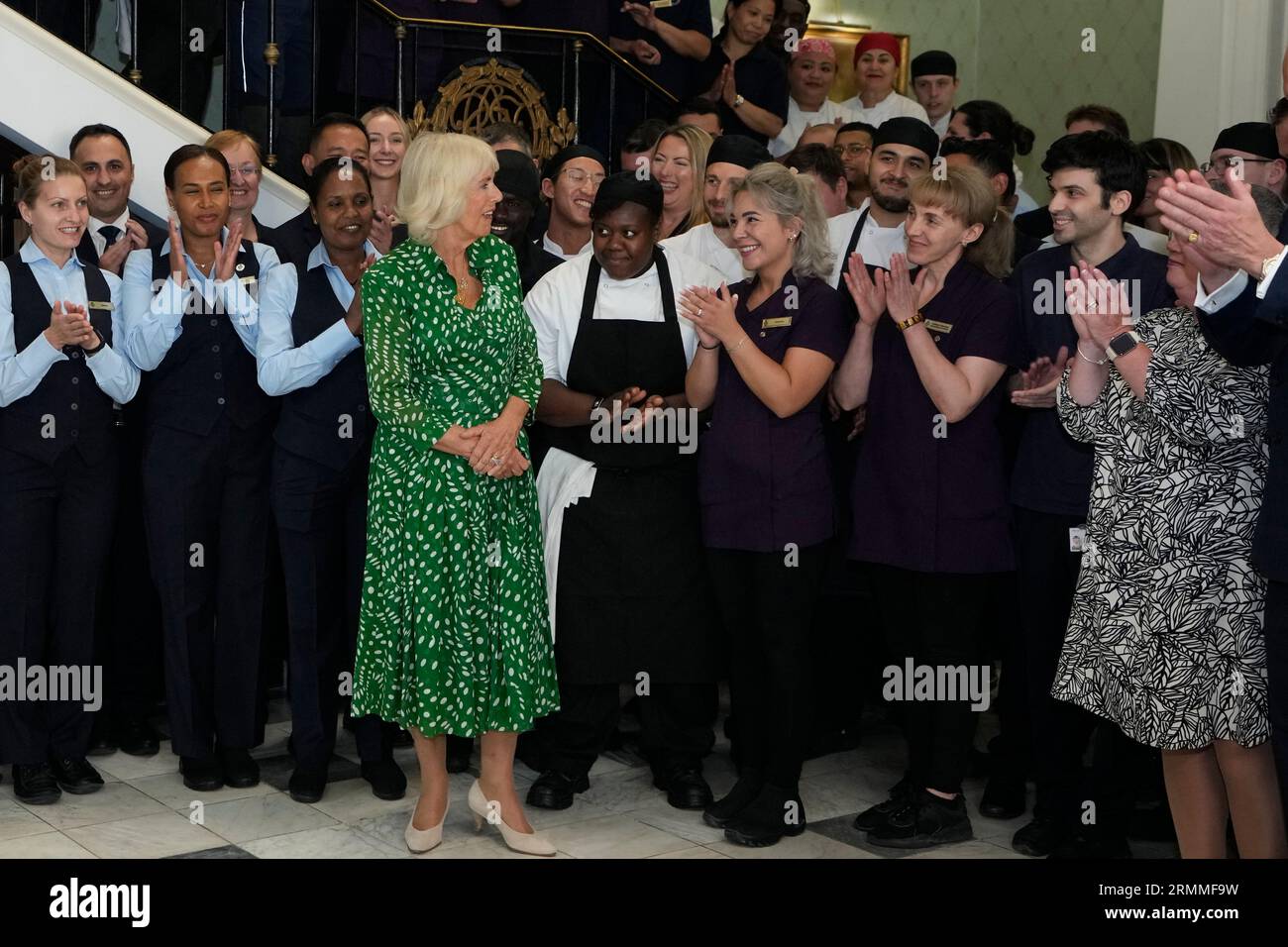 Queen Camilla with members of staff at the Royal Air Force Club in Piccadilly, central London, where she unveiled a portrait of Special Operations Executive (SOE) Operative, Noor-un-Nisa Inayat Khan GC, and formally announced the naming of a room in her honour. Picture date: Tuesday August 29, 2023. Stock Photo