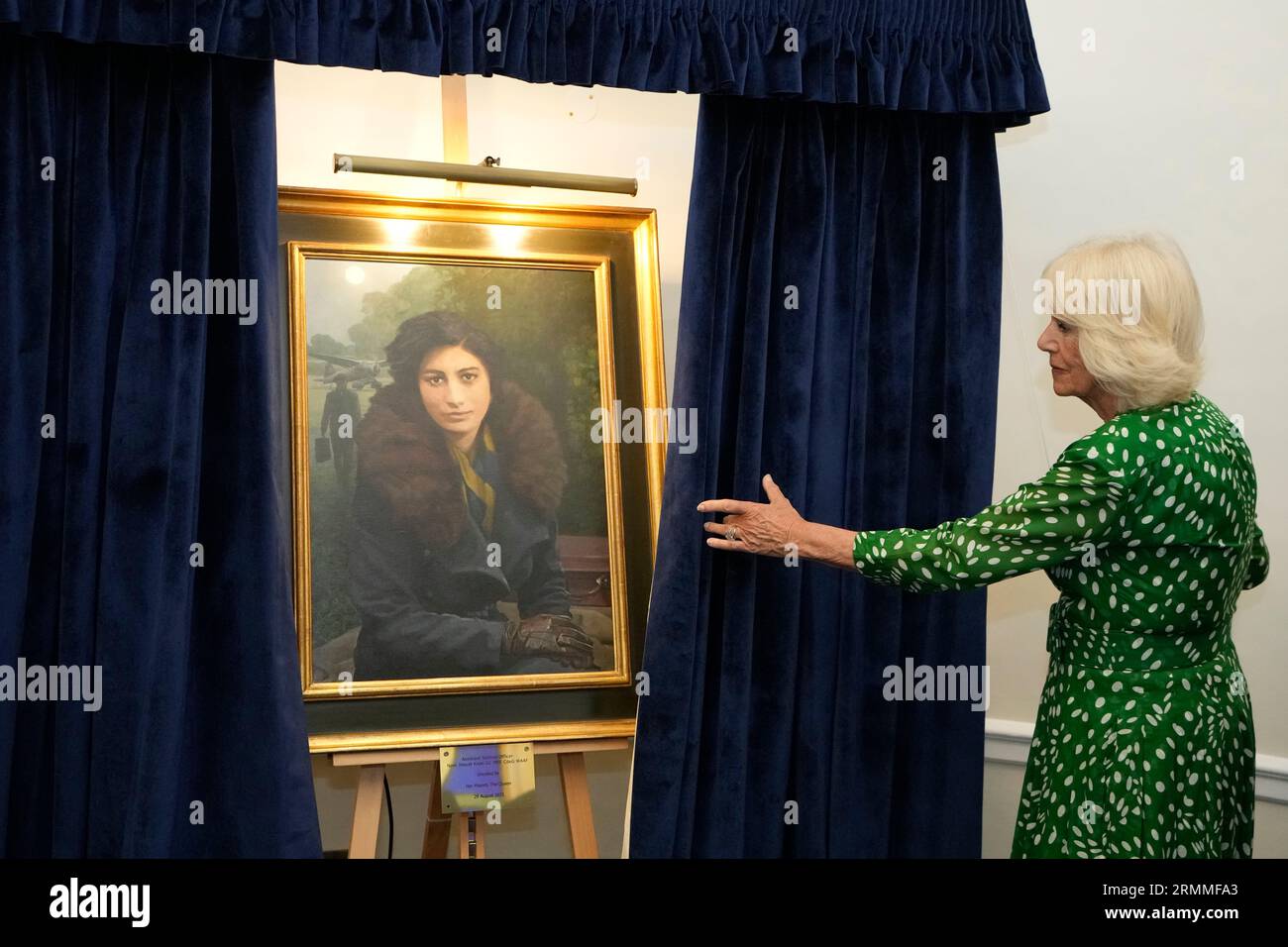 Queen Camilla unveils a portrait of Special Operations Executive (SOE) Operative, Noor-un-Nisa Inayat Khan GC, and formally announces the naming of a room in her honour at the Royal Air Force Club in Piccadilly, central London. Picture date: Tuesday August 29, 2023. Stock Photo