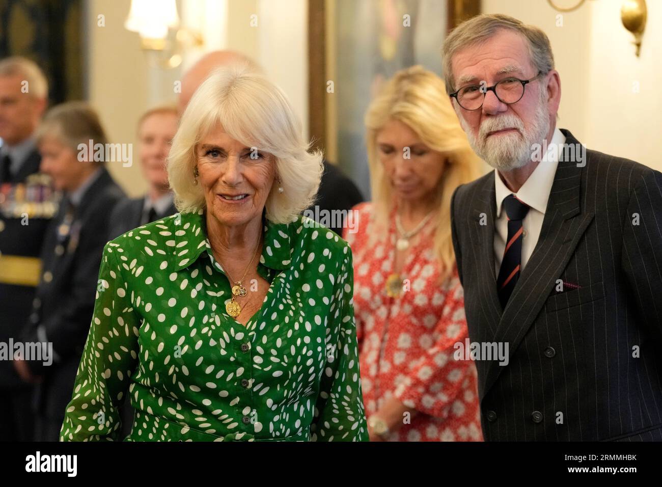 Queen Camilla meets artist Paul Brason at the Royal Air Force Club in Piccadilly, central London, where she unveiled a portrait of Special Operations Executive (SOE) Operative, Noor-un-Nisa Inayat Khan GC, and formally announced the naming of a room in her honour. Picture date: Tuesday August 29, 2023. Stock Photo