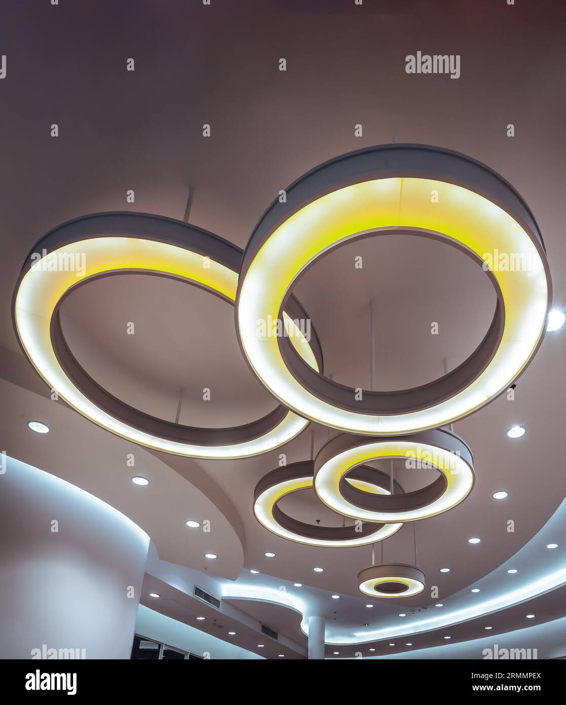 Hanging rounded ceiling mounted light fixtures with modern LED light