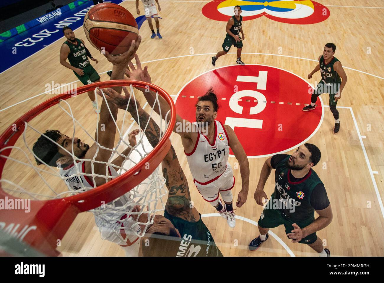Anas Mahmoud (10) and Assem Marei (50) of Egypt and Fabian Jaimes (3) of Mexico vie for the ball during the Basketball World Cup Group D game between Egypt and Mexico, Tuesday, Aug. 29, 2023, in Manila, Philippines. (AP Photo/Ezra Acayan, Pool) Stock Photo