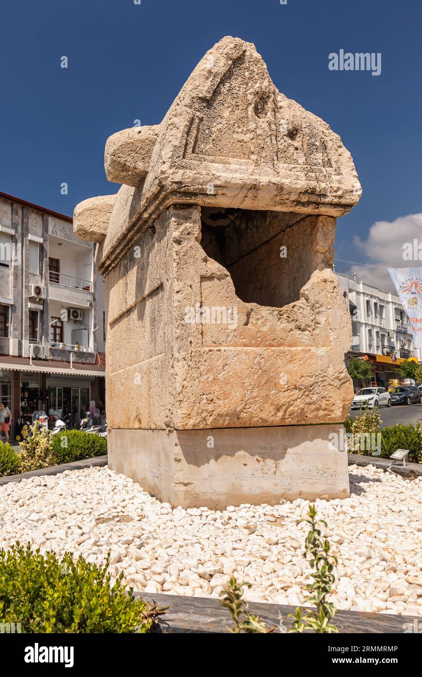 An old Lycian tomb on the roundabout in the the town centre of Kas, Turkey. Stock Photo