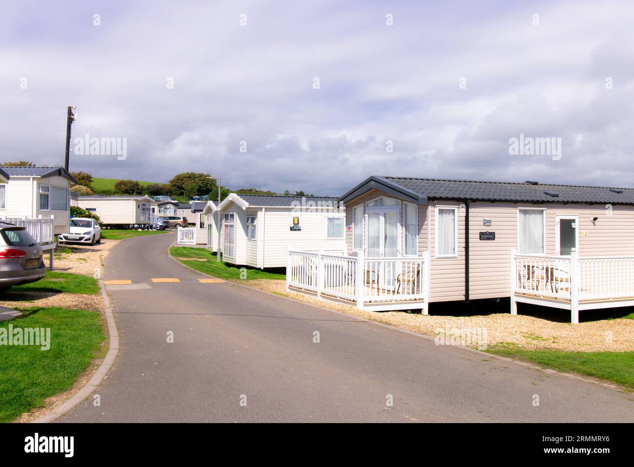 Static caravan site UK - Static caravans on a holiday site on the coast; West Bay, Dorset UK. British lifestyle Stock Photo