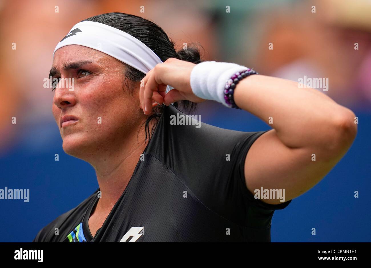 Ons Jabeur, of Tunisia, adjusts her shirt during a match against Camila  Osorio, of Colombia, during the first round of the U.S. Open tennis  championships, Tuesday, Aug. 29, 2023, in New York. (