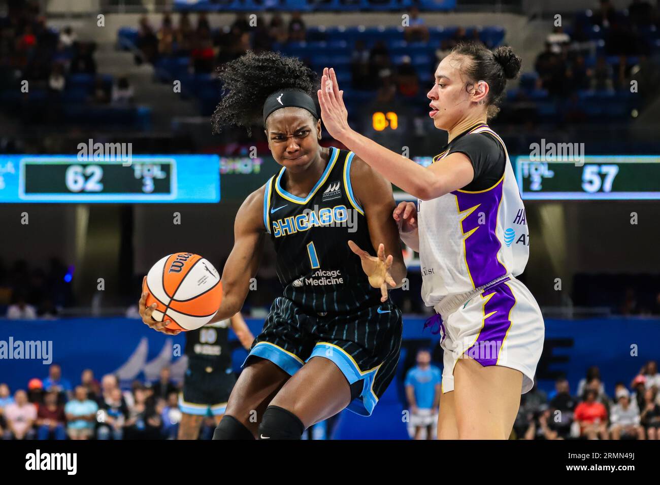 Elizabeth Williams of the Chicago Sky dribbling around a LA Sparks defender, making her way through the lane in Chicago, IL at Wintrust Arena. Stock Photo