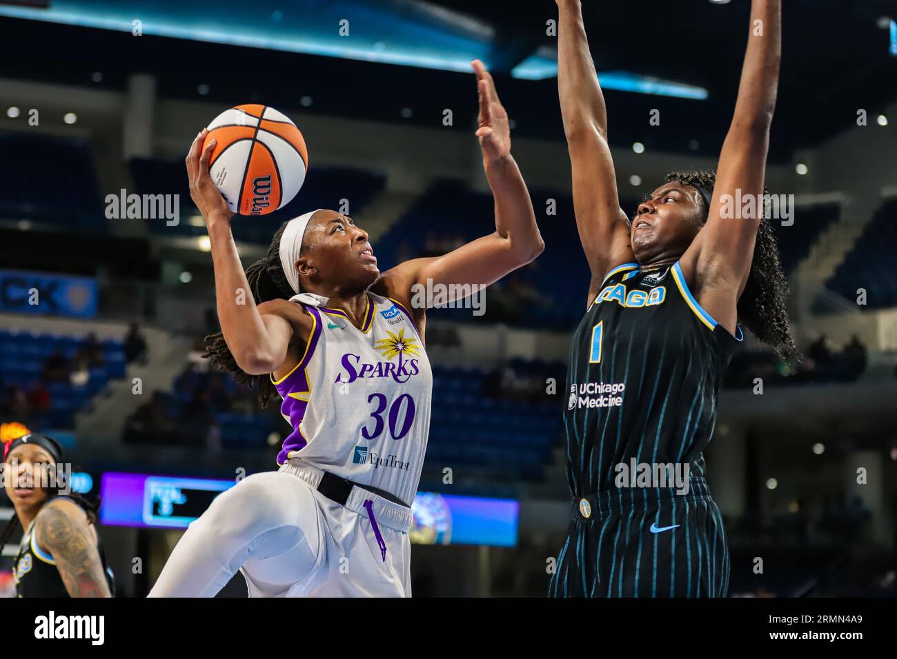 Nneka Ogwumike of the LA Sparks goes up for a layup over Chicago Sky's Elizabeth Williams in Chicago, IL at Wintrust Arena. Stock Photo