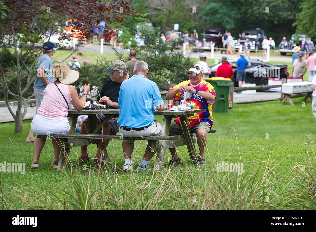 Dennis Festival Days.    Families picnicking at the end of the antique car parade. Stock Photo