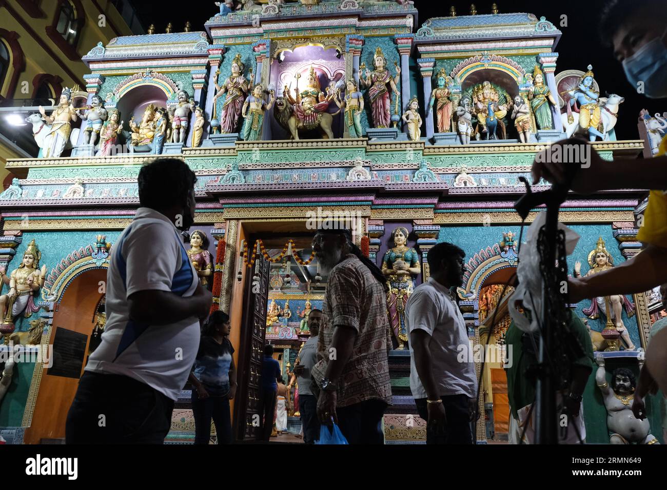 Worshippers at night at the Sri Vadapathira Kaliamman Temple near Little India in Singapore. 13/10/2022 Stock Photo