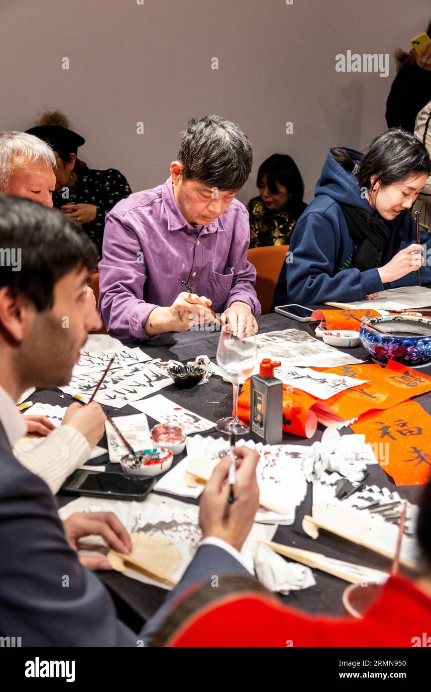 Fan painting and calligraphy workshop at Christie's Lates: Year of the Rabbit 2023, London, England Stock Photo