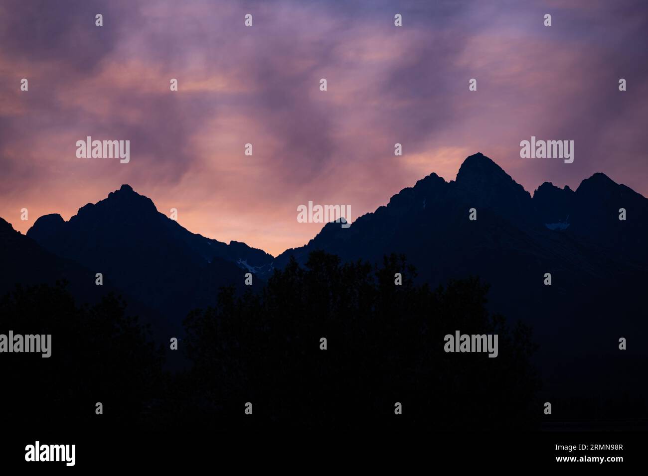 Pink evening sky over the Tatra mountains in Slovakia. Stock Photo