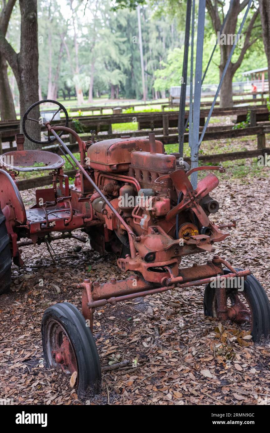 Photo of old red tractor at a farm in Florida USA Stock Photo - Alamy