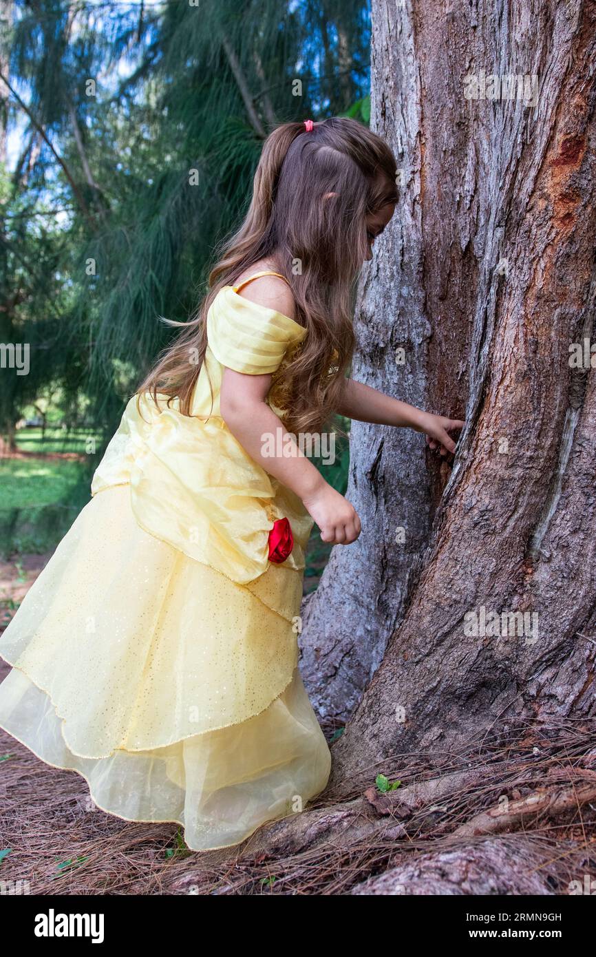 Photo of a young girl next to a tree at a south Florida Park. Stock Photo