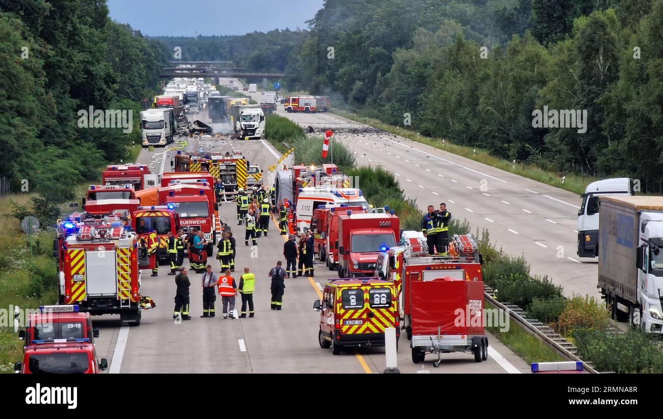 29 August 2023, Saxony-Anhalt, Theeßen: Helpers stand at the scene of an accident. Several gas cylinders exploded on a truck on Tuesday on highway 2 between Theeßen and Burg (both Jerichower Land). In the direction of Hanover, there was a rear-end collision on Tuesday afternoon, the police said. Both directions were still closed in the afternoon. Photo: Cevin Dettlaff/dpa-Zentralbild/dpa Stock Photo