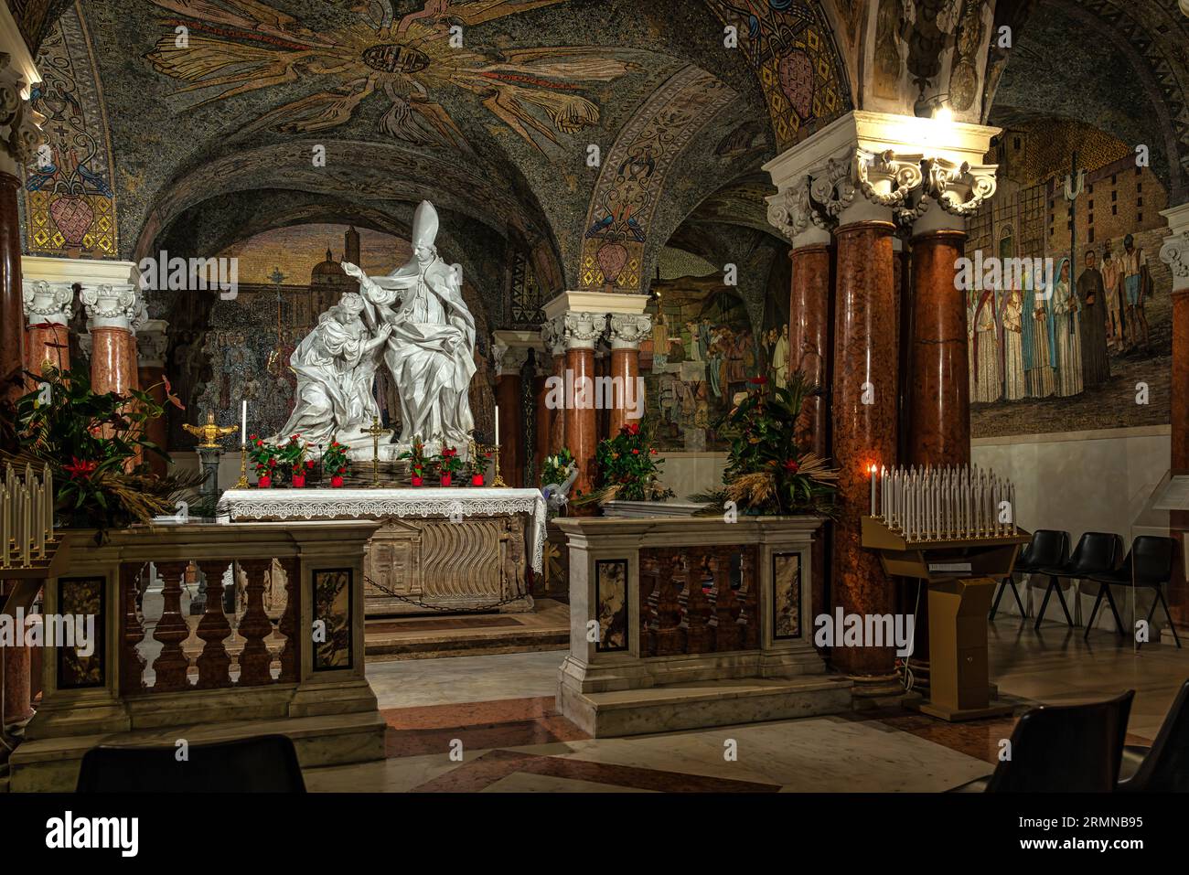 The statuary group of the Baptism of Polisia, the sarcophagus with the remains of Sant'Emidio in the crypt under the cathedral of Ascoli Piceno. Stock Photo