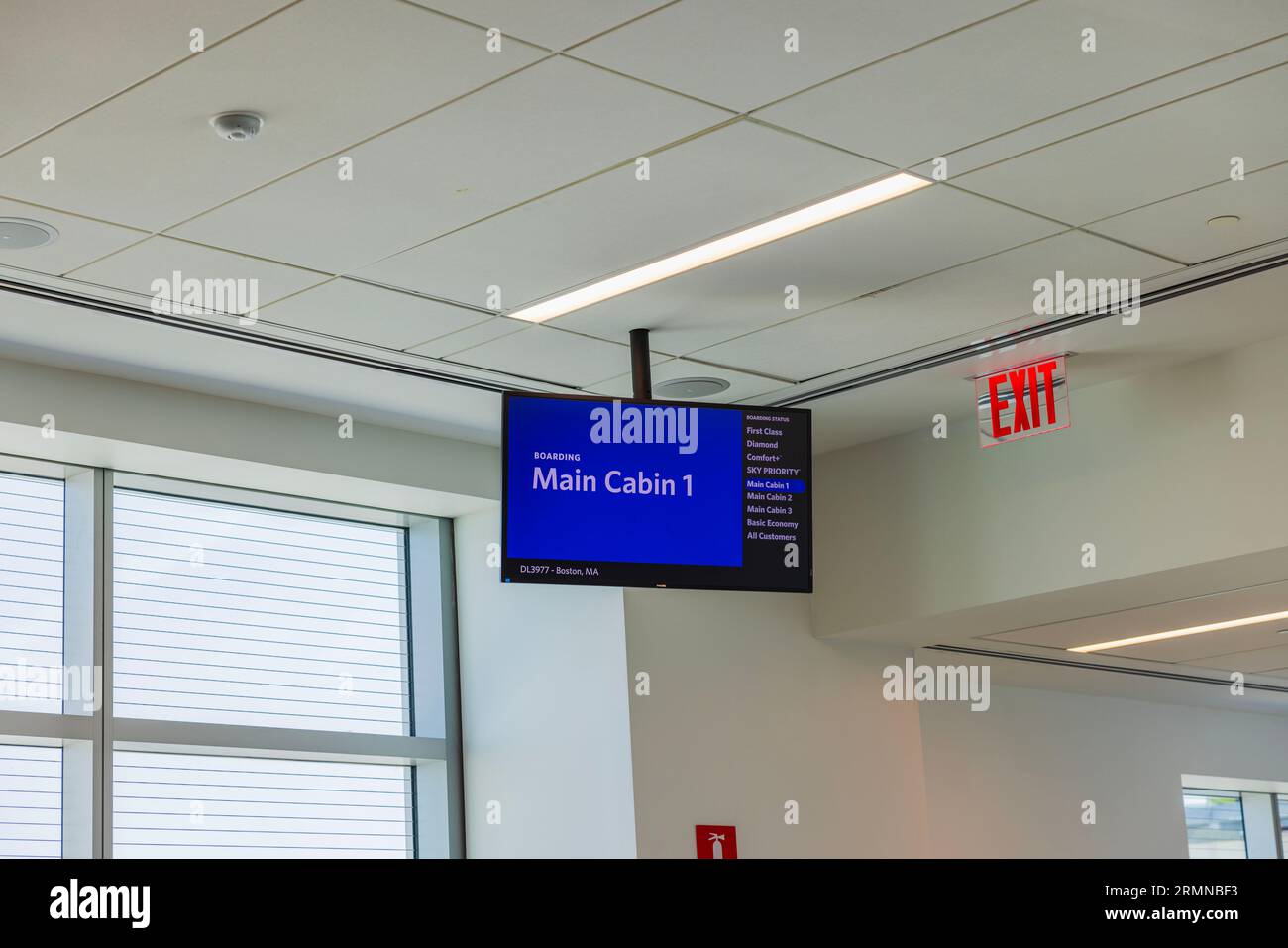 View of airport display invitation for main cabin passengers going on board. USA. Miami Beach. Stock Photo