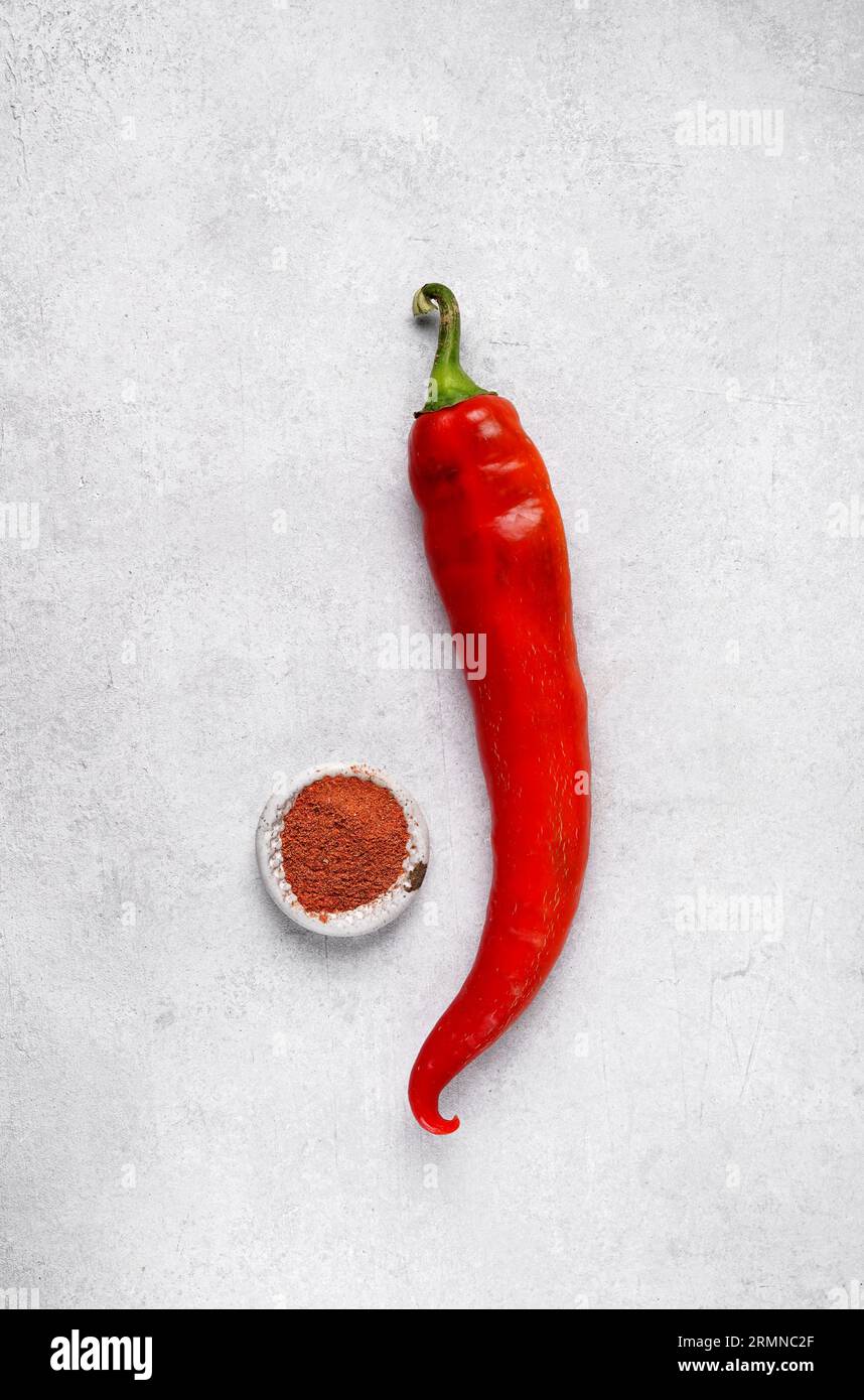 Red sweet bell peppers on table and paprika, top view Stock Photo - Alamy