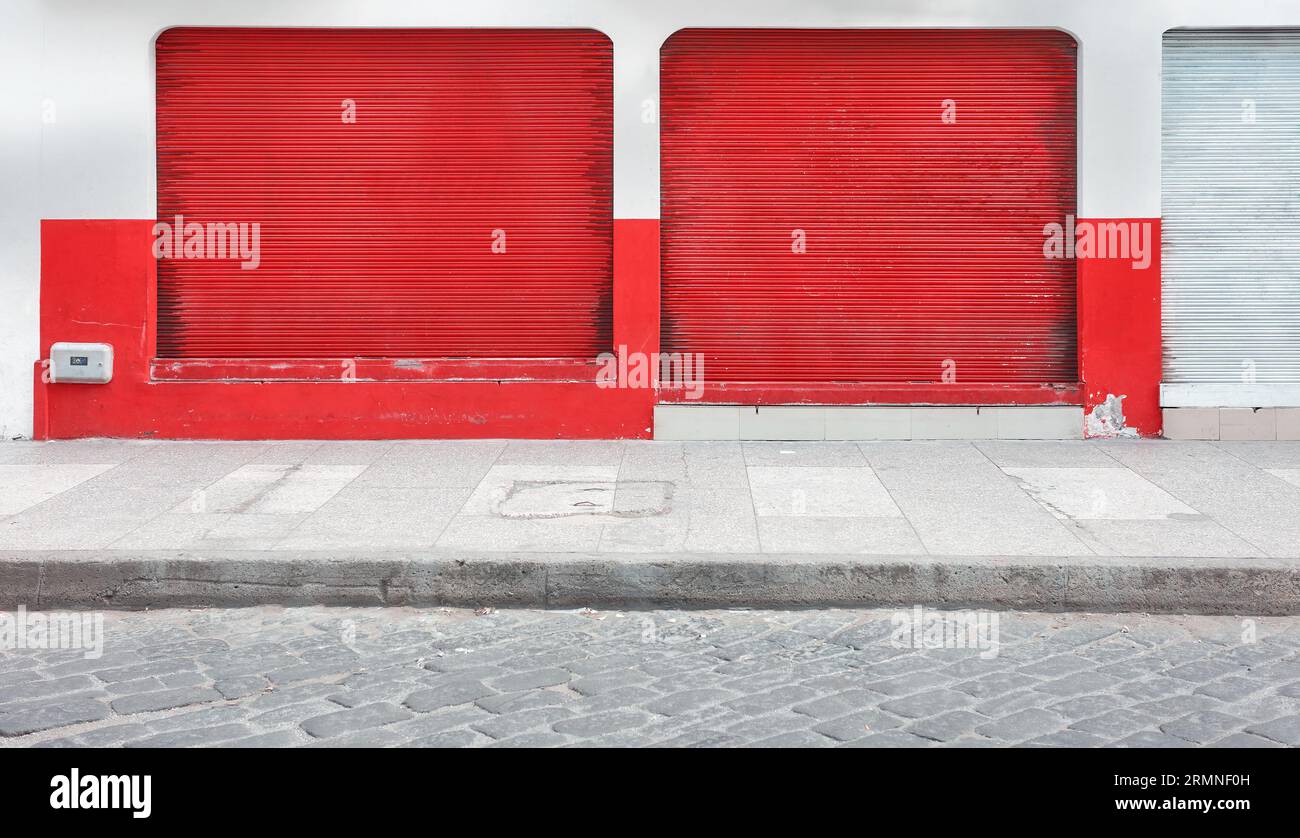 Street view of a shop with closed rolling shutters Stock Photo - Alamy