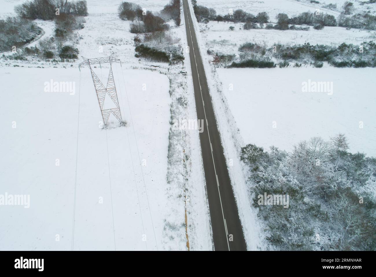 aerial view of a road in a snowy field Stock Photo - Alamy
