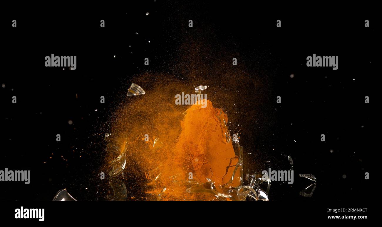 Turmeric Powder Splatter Turmeric, curcuma longa, Powder in a Small Jar Exploding against Black ...