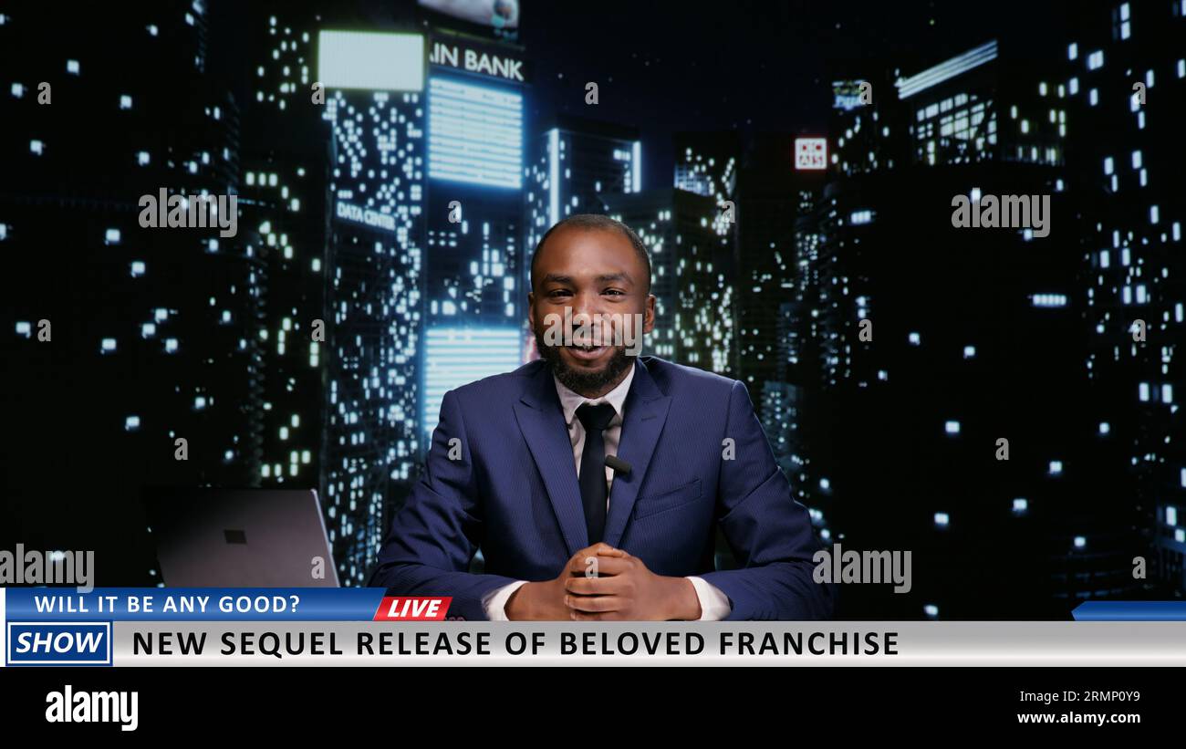 Presenter announcing new movie premiere on late night talk show, discussing about famous film franchise on live television program. African american host presenting world news. Stock Photo