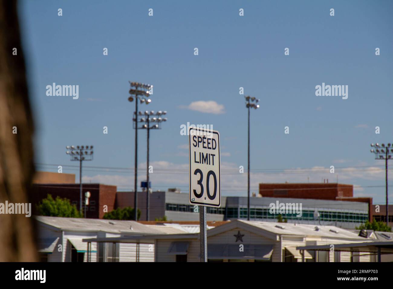 A photo of a speed limit sign on an urban road Stock Photo