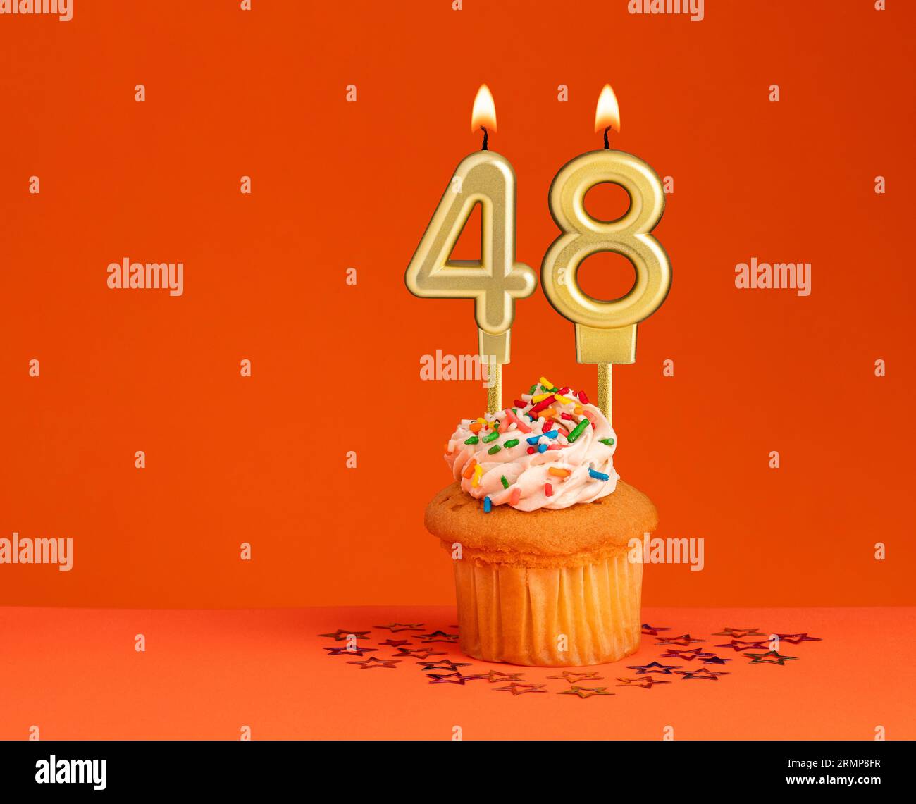 Birthday candle number 48 - Invitation card with orange background Stock Photo