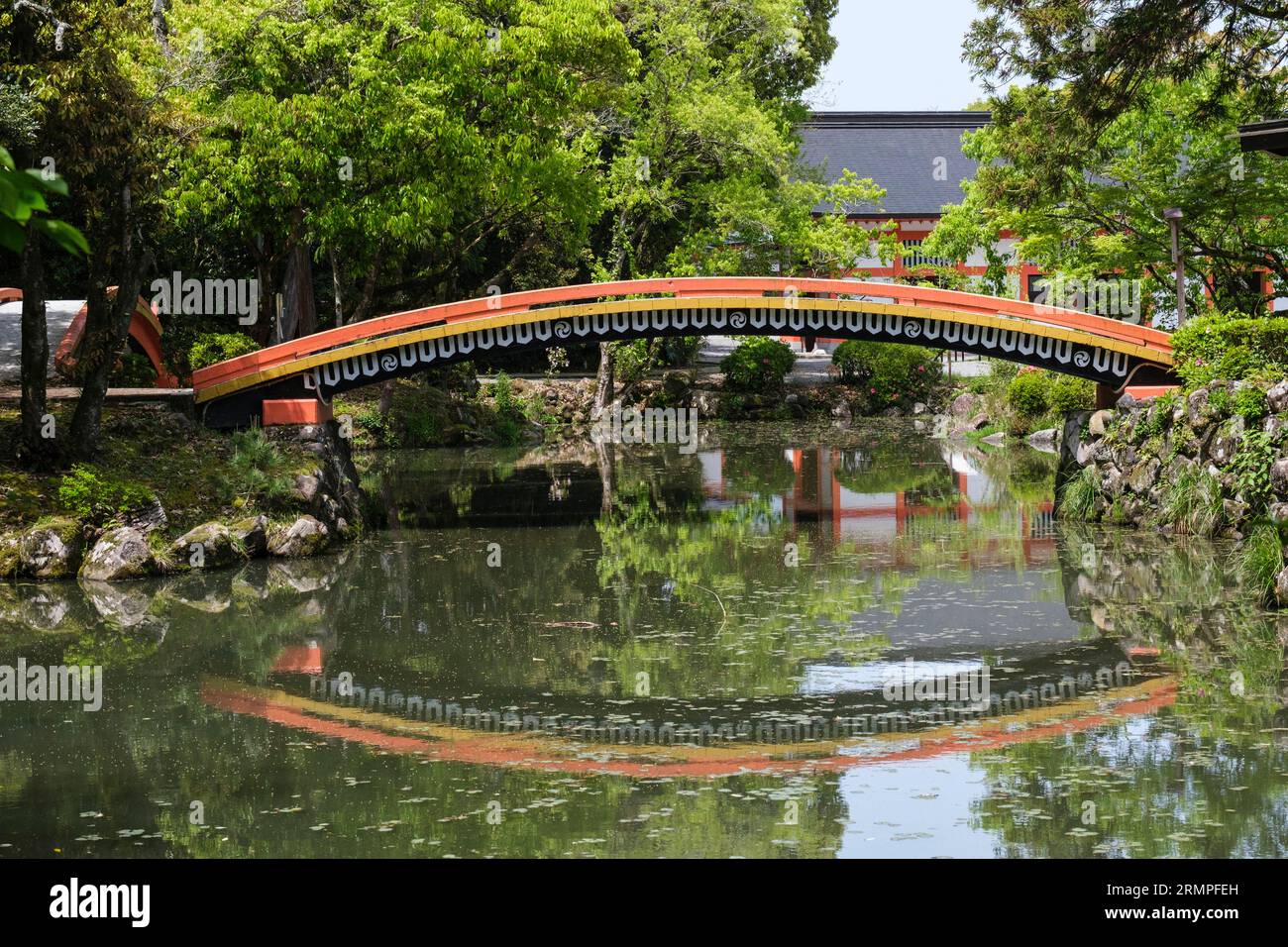 Japan, Kyushu. Bridge over Pond in the Usa Jingu Shinto Shrine Complex. Stock Photo