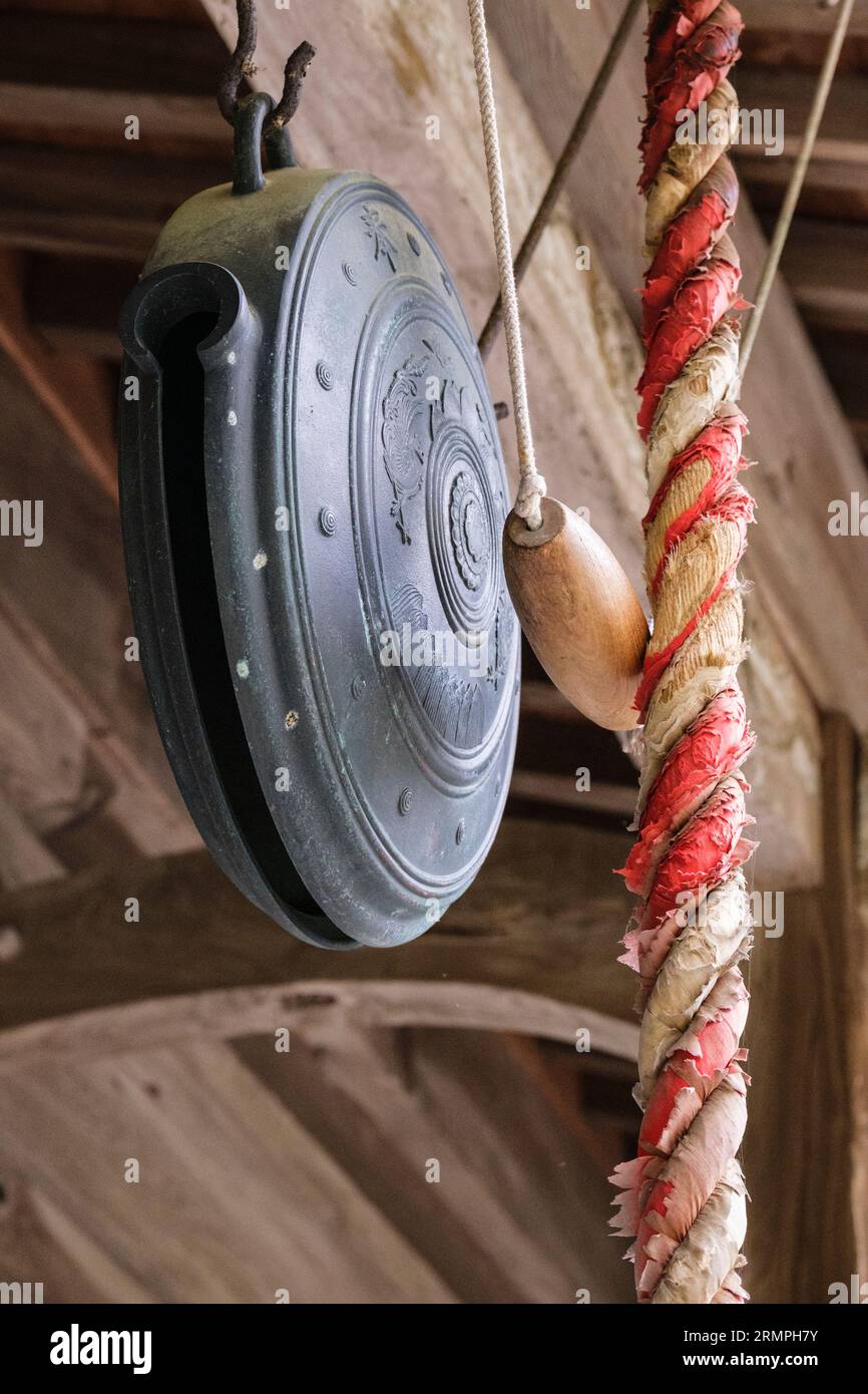 Japan, Kyushu. Makiodo Temple, Ringing the Temple Bell, or Gong Stock